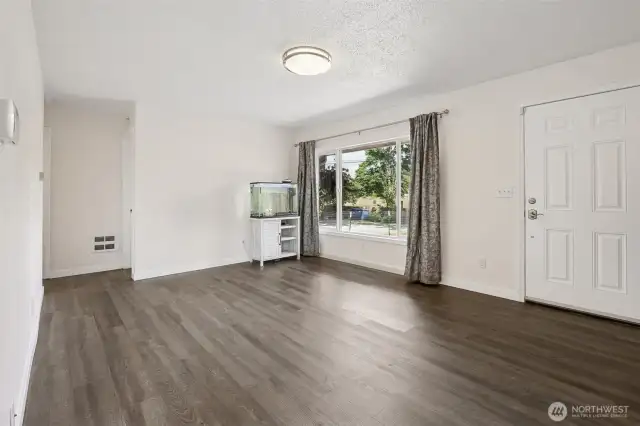 Welcome in to the bright and fresh living room. Brand new laminate flooring throughout the whole house for easy maintenance.