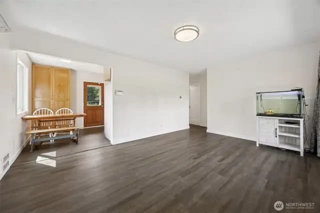 Living room, looking towards the eating area that provides good storage space as well. Ductless mini-splits for year round high efficiency heating and cooling.