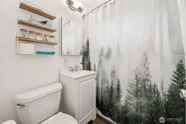 Full bathroom with tub/shower combo.