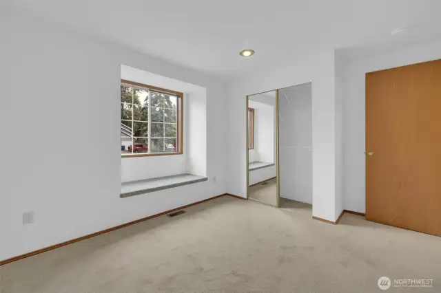 Big secondary bedroom with window seat & storage