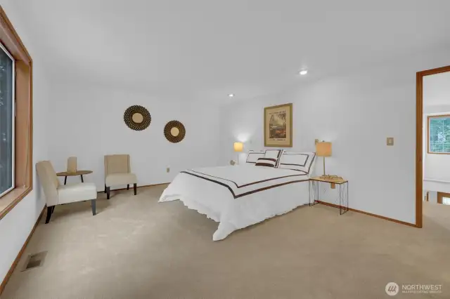 Spacious primary bedroom with sitting area. Plenty of room for all your furniture