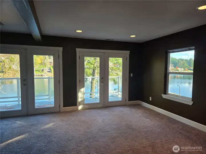 Primary with full water views & private balcony.