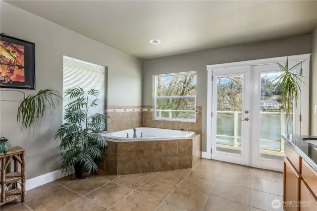 Jetted tub & french doors off main suite up.
