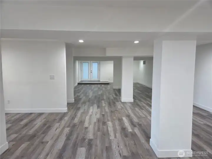 A ton of lower level living has separate entry to beach access & entry to detached garage.