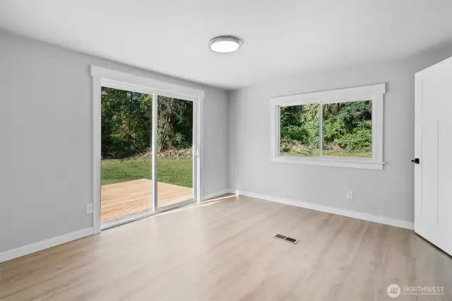 Generously Sized Primary Bedroom w/ Slider for Peaceful Outdoor Views