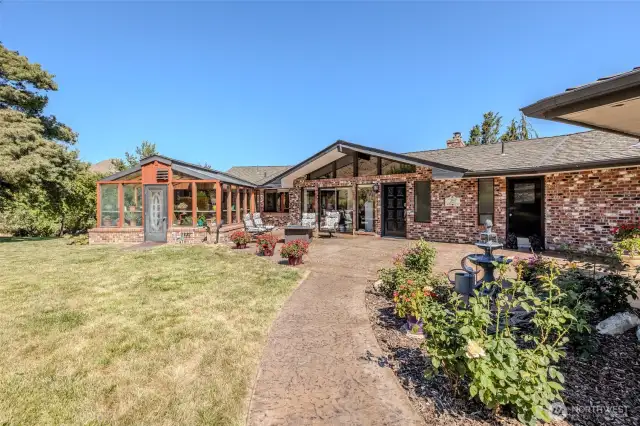 Bricked exterior with expansive front patio
