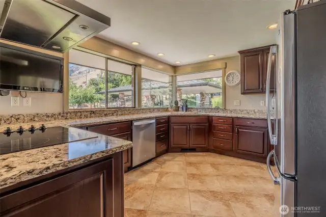 Kitchen with expansive counter space and large windows