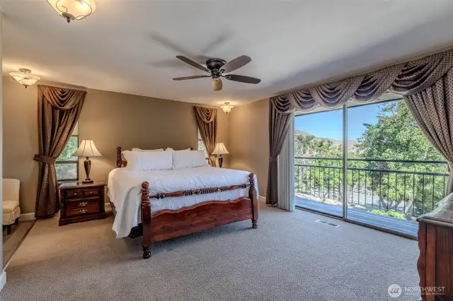 Primary bedroom with balcony