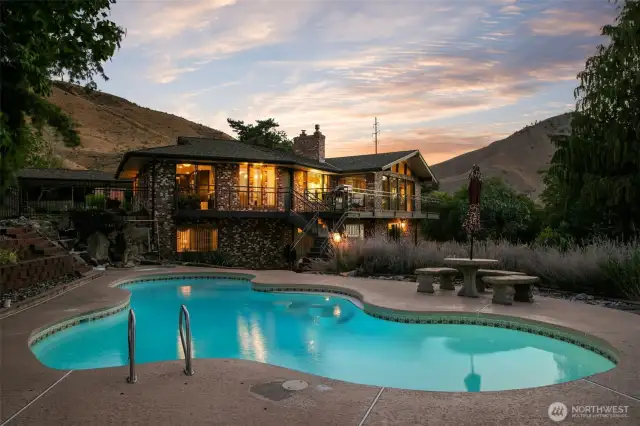 Pool and home at night