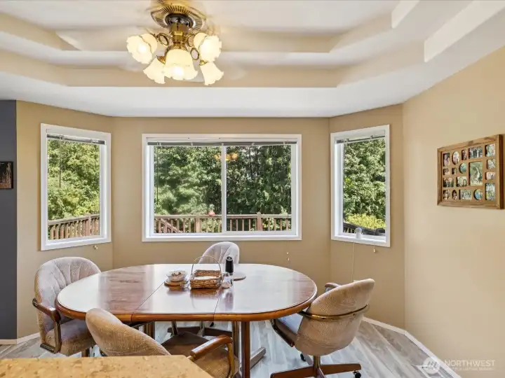 Eating area with elegant recessed ceilings.