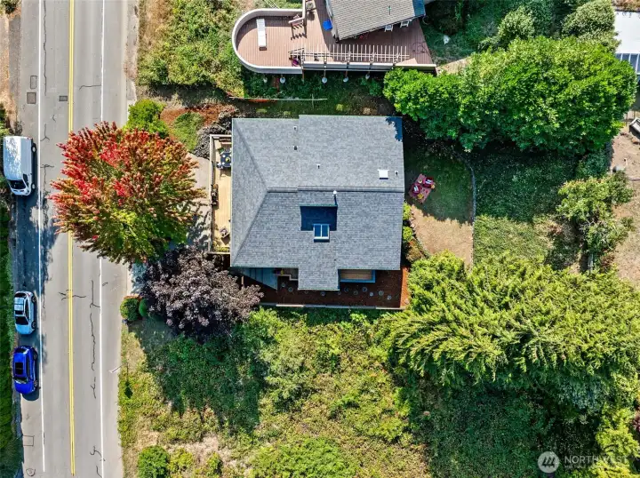 Enjoy the privacy this large lot, hill-side setting provides, while just minutes from commuter routes and urban services.