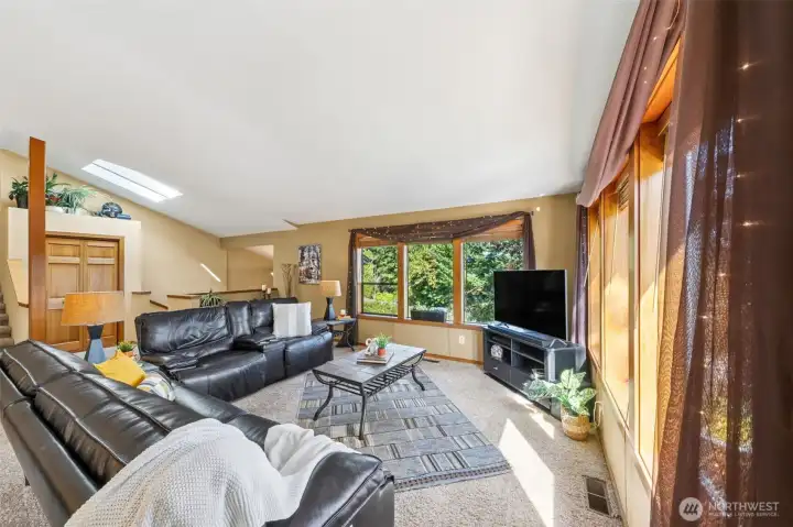 Skylights warm the interior entry stairs the lead to this wonderful, great-room living area, offering multiple-use options and flexible space for your furniture style.