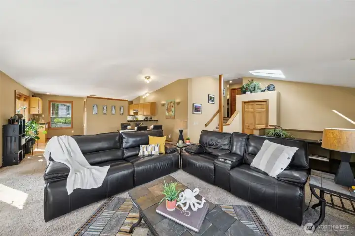 The great room space handles large , comfy reclining or your vision of a living space.  Plush, neutral tone carpets were added in the last few years.  Ask your agent for the upgrade date sheet in the supplements section.
