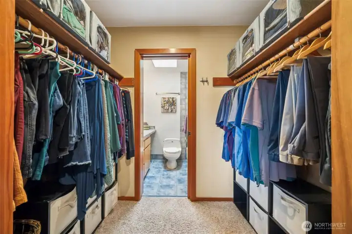 The pass through closet offers loads of hanging and storage space with the full primary bath just beyond.