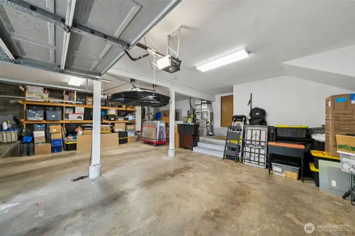 The huge two car garage offers space galore for storage with built-in shelves and a utility platform to keep the furnace and water heater away from vehicles.  More storage there too!
