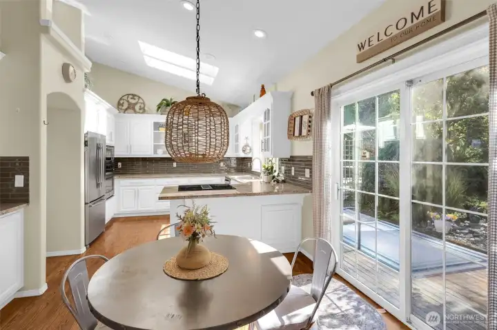 Kitchen incudes a cozy eating area for casual meals.