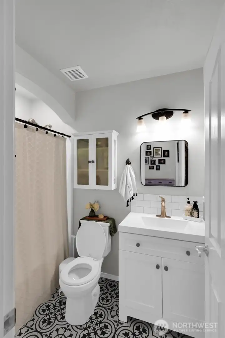 Full bathroom located right by lower bedroom.
