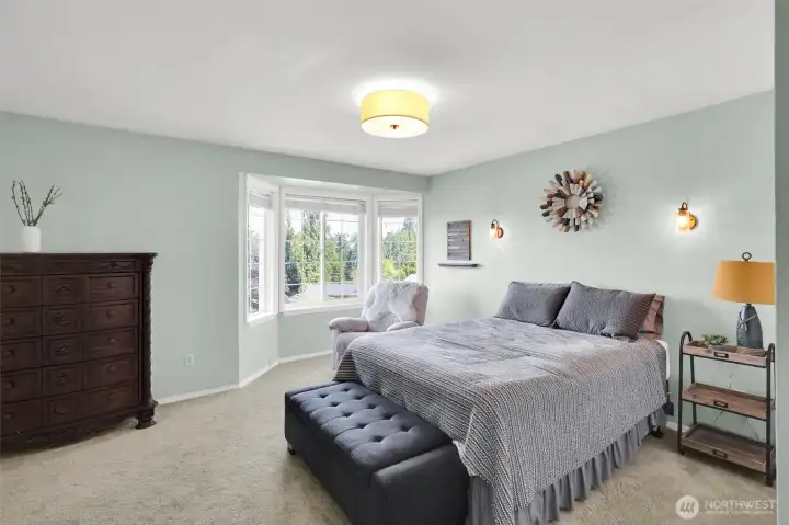 Tranquil primary bedroom designed for comfort.
