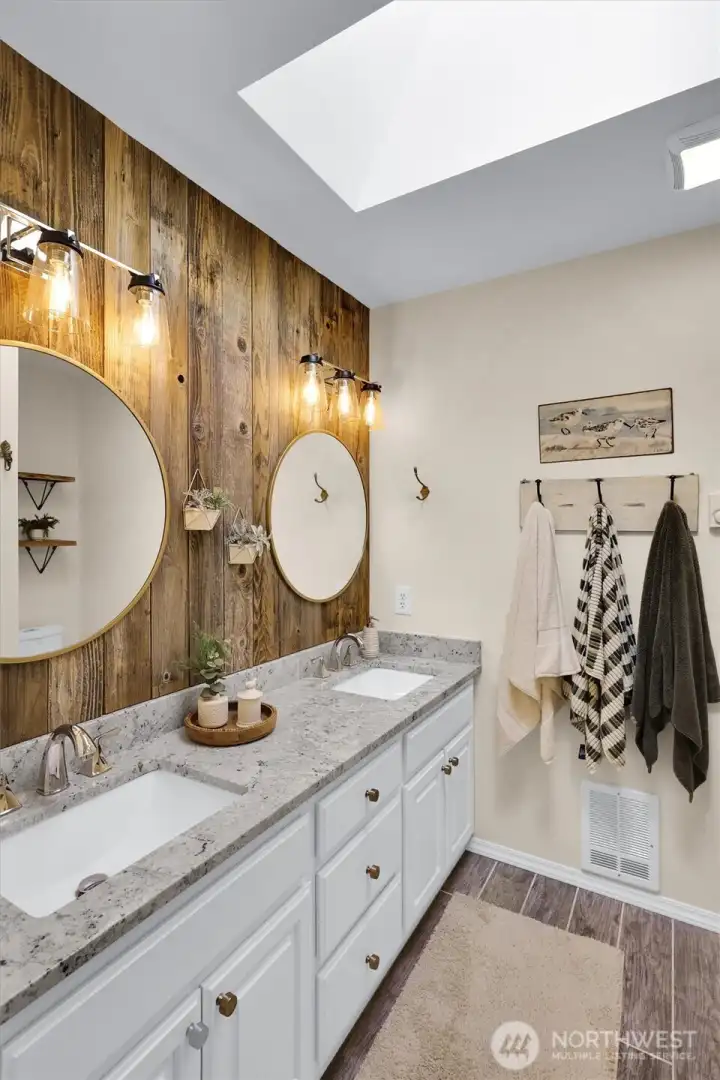 Spacious + bright with a spa like feel.