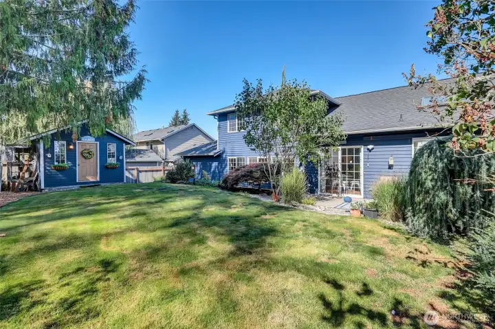 Expansive backyard with room to relax + play + garden.