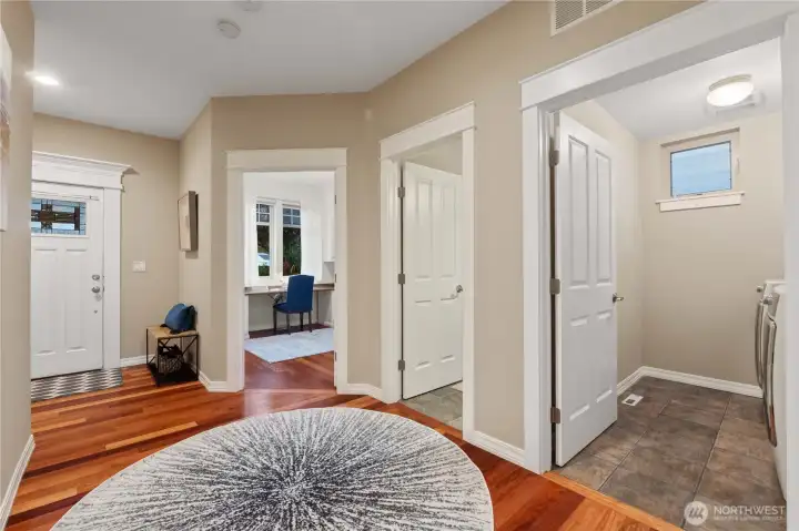 Looking back at the entry, office/bedroom, powder room, and laundry room.