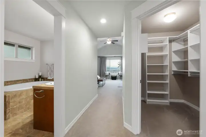 Your primary suite is HUGE with TWO closets (the large walk-in closet is pictured here), and a 5-piece en suite bathroom.