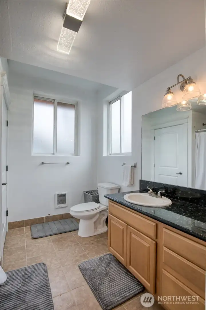 The three quarter bathroom is also abundant with storage.