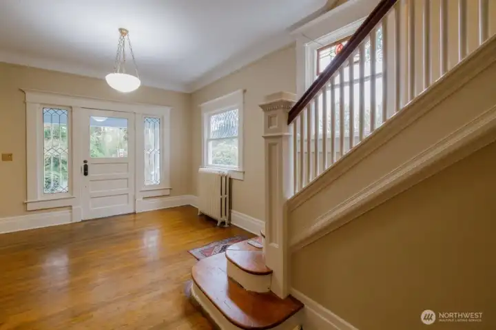 Gorgeous wood floors, and wood stairwell.