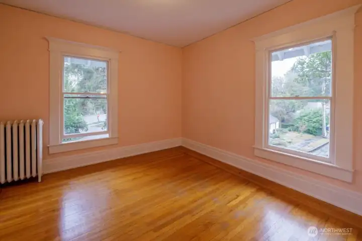 Upstairs are the large bedrooms. This front bedroom overlooks the yard and features a built-in vanity.