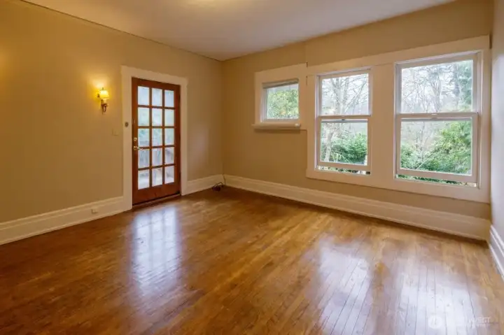 Studio upstairs with a separate entrance, kitchenette, storage cabinetry, and full bath overlooks the backyard. Offering built-in closets, it would be an additional bedroom/sleeping space as well.