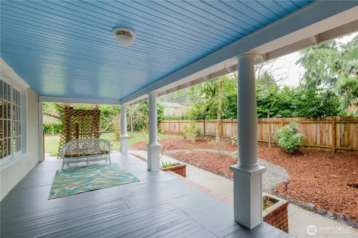 Wrap-around porch with fresh coat of paint, sliding fence and access to the large, fenced yard.