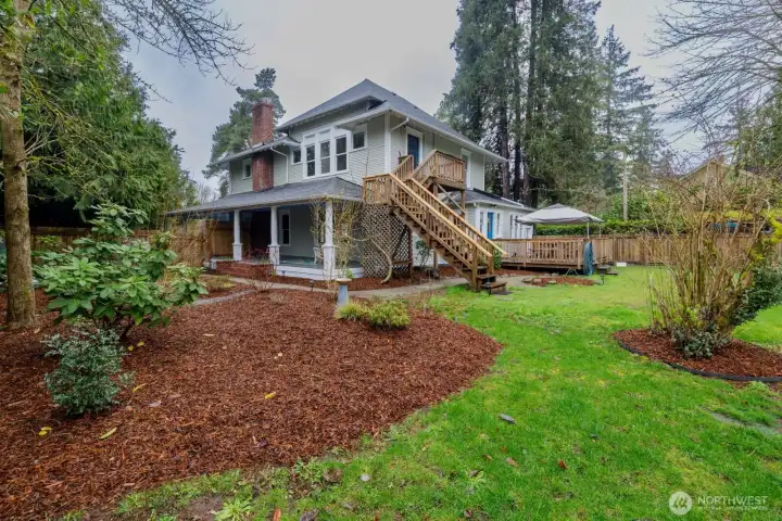 Large deck in the backyard with cover, stairs to the exterior entry for the studio, and with a seating area atop.  Detached shed for storage of your garden implements.