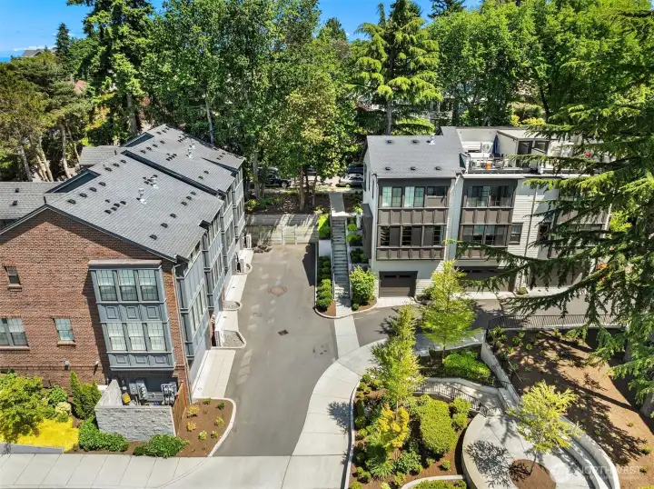 This townhome community offers convenient garage access and beautifully maintained grounds that elevate the neighborhood’s charm.