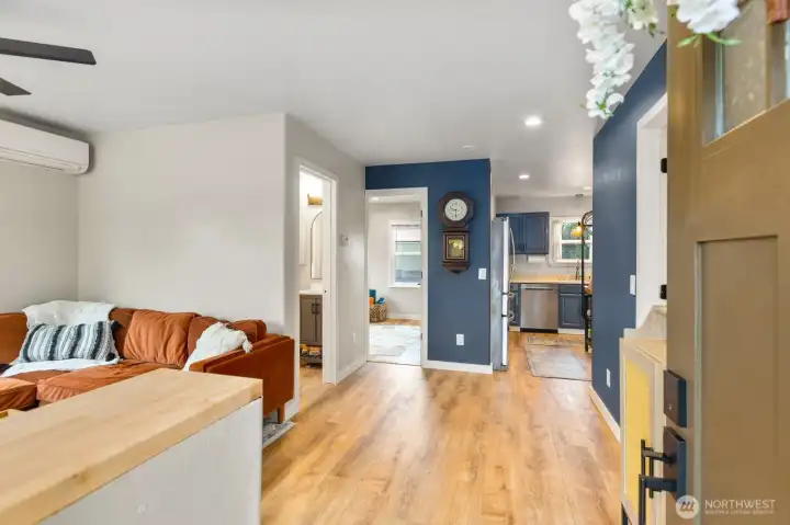 Seamless flow between kitchen, living, and dining.