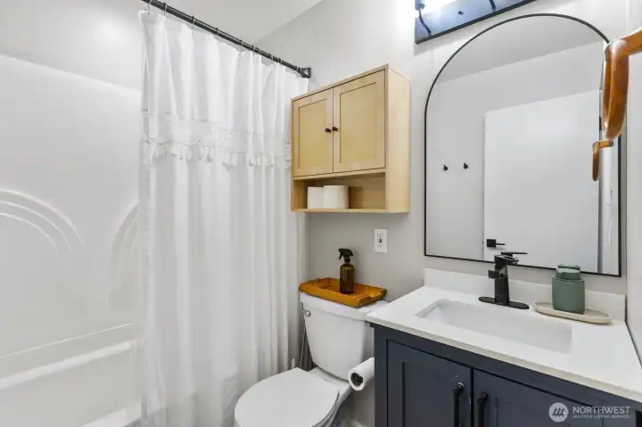 Fully renovated bathroom with quartz vanity& tub-shower combo.