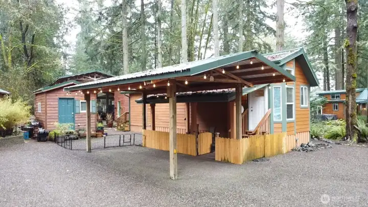 21 SPRUCE CABIN WITH 2 SHEDS, WASHER/DRYER - 120 GALLON IN GROUND PROPANE TANK, CARPORT