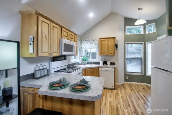 KITCHEN WITH BAR AND 2 STOOLS