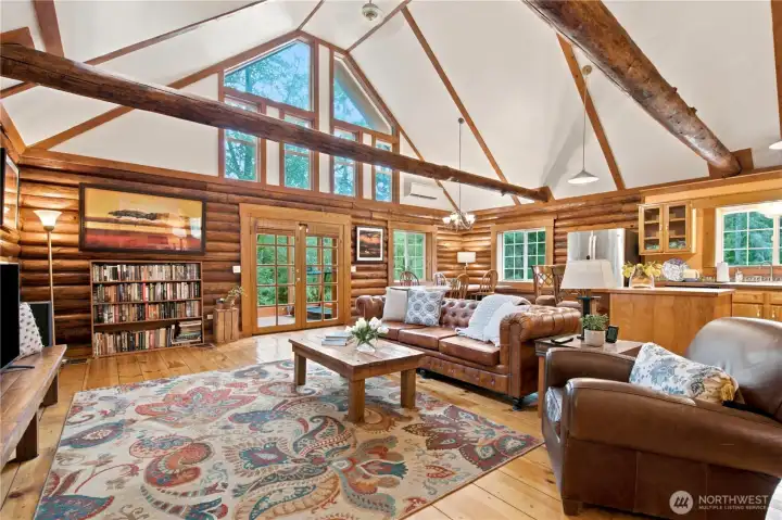 Living room with large with high ceilings and large picture windows Living room with large with high ceilings and large picture windows