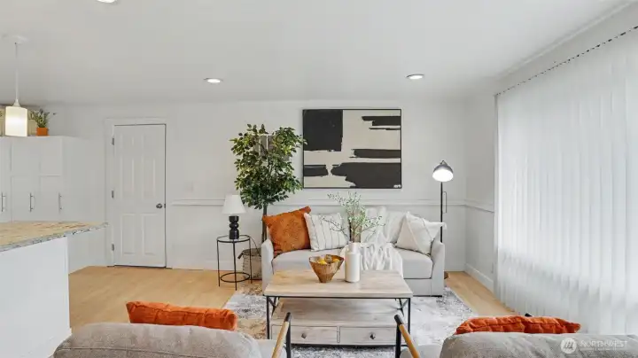 Bright and inviting living area with seamless flow into the kitchen.