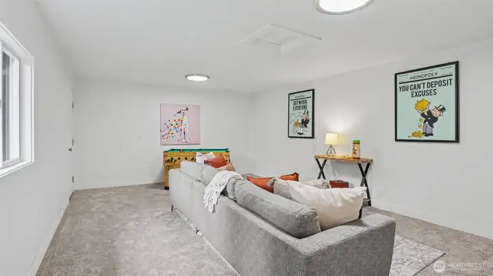 Open living space with contemporary styling - ideal for second living space, rec room, or entertainment area.