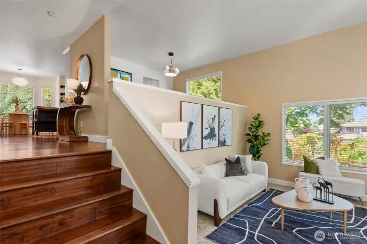 A grand wide-stair entrance creates an impressive first impression, leading to dining area, a spacious family room and kitchen