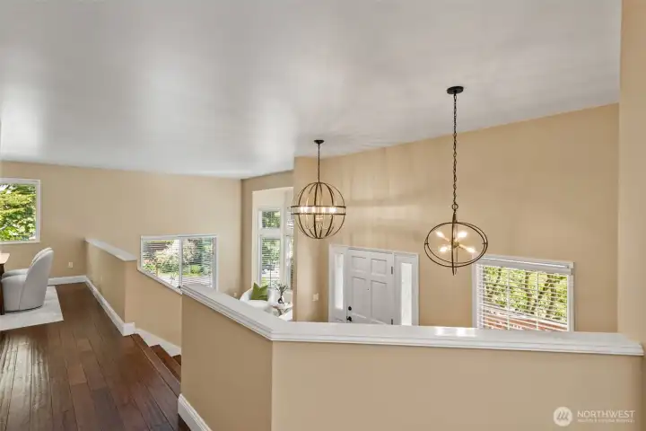Foyer with new wide-stair entrance and new modern light fixtures
