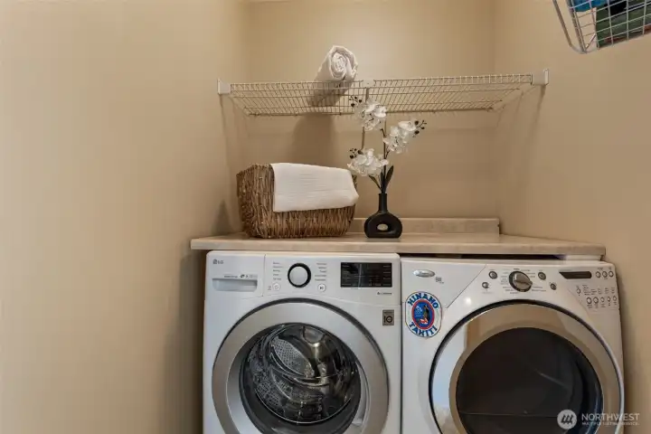 Laundry room with shelf space