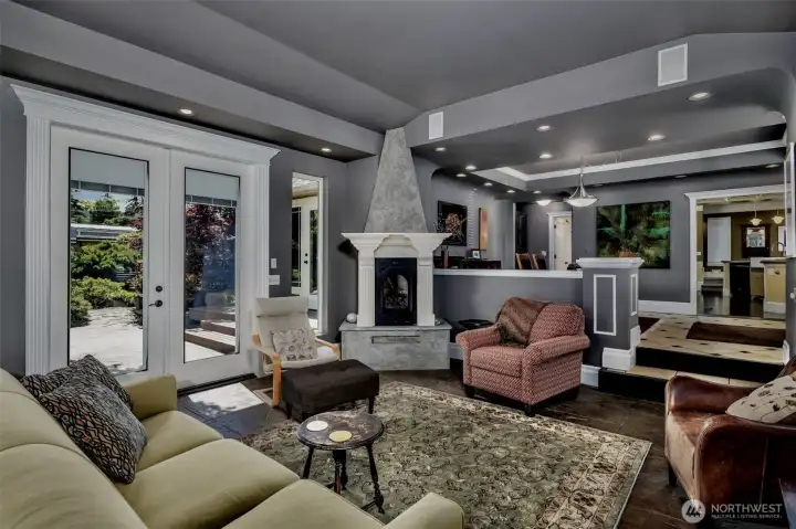 Living Room With Gas Fireplace is Open to Dining Area and has French Doors to Yard Living Room With Gas Fireplace is Open to Dining Area and has French Doors to Yard