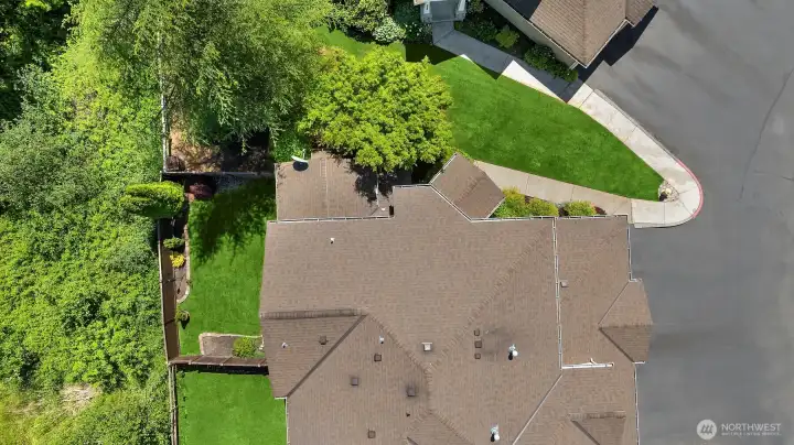 A top down view of the end unit townhome, the fenced in back yard space, and the greenbelt for privacy!