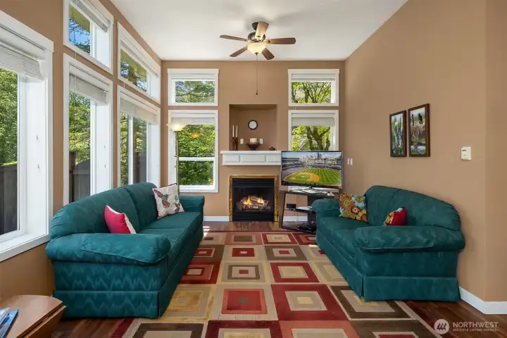 Main Living Room w/ high ceilings, loads of beautiful windows looking outside, excellent natural lighting, and a cozy gas log fireplace! Main Living Room w/ high ceilings, loads of beautiful windows looking outside, excellent natural lighting, and a cozy gas log fireplace!