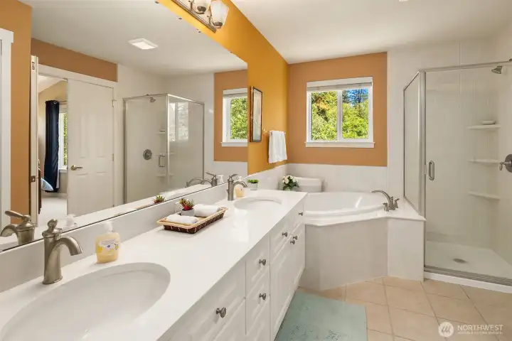 The Spacious Primary Bathroom with Dual Sinks & Separate Shower and soaking tub The Spacious Primary Bathroom with Dual Sinks & Separate Shower and soaking tub