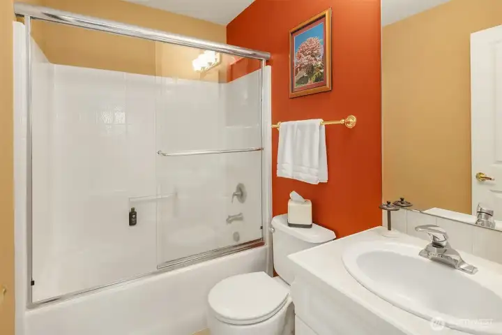 The Ensuite Bathroom has a shower over the tub