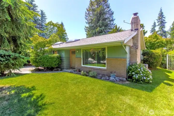 Lovely rambler with beautiful brick and cedar siding, located in North Hill Des Moines.