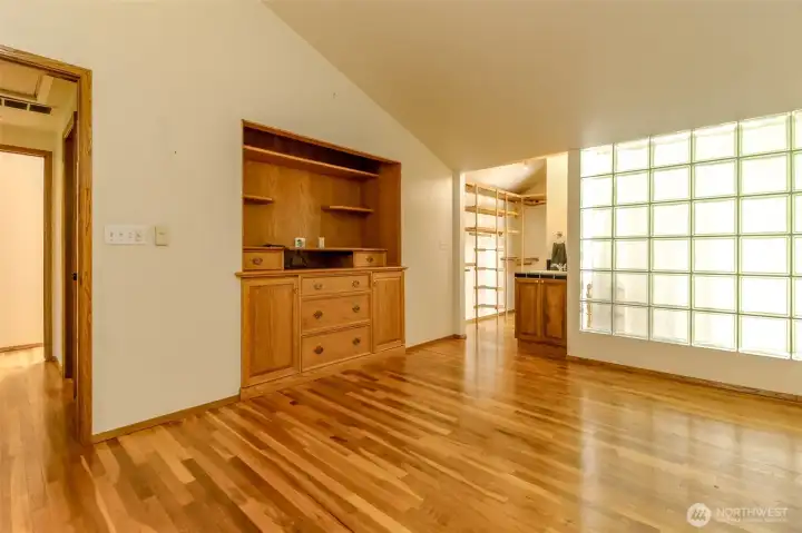 Check out the primary's spacious built-in. The closet is open, just beyond the sink.